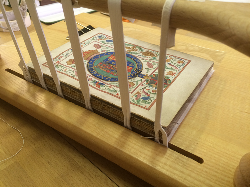 Westminster Cathedral Archives' Queen Mary Manual for the Blessing of Cramp Rings, here being re-sewn